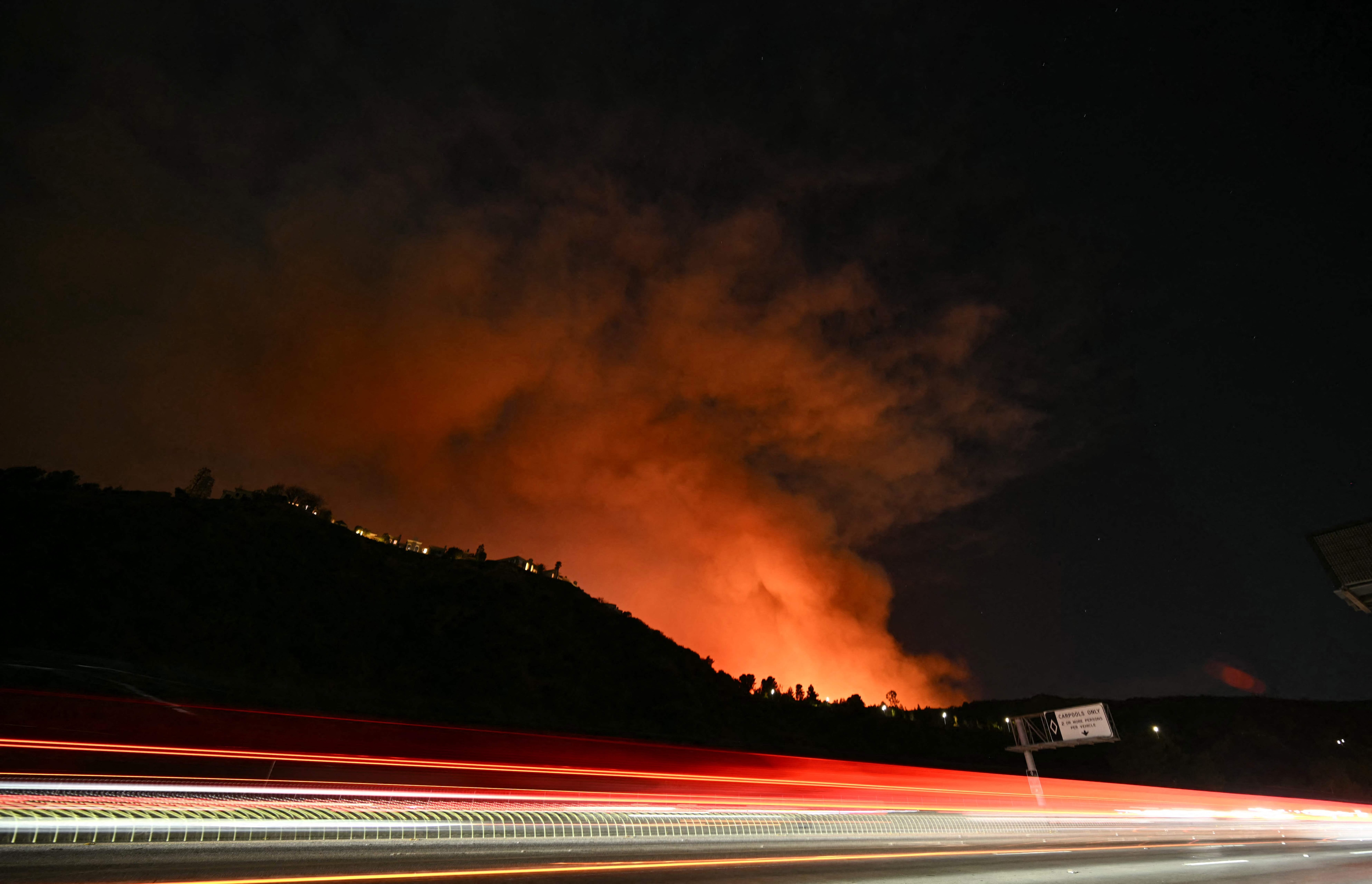 Smoke and flames from the Palisades Fire burn the hillside on the east side of the 405 freeway at the Sepulveda Pass, making their way toward the Encino neighbourhood of Los Angeles, California. (AFP) Smoke and flames from the Palisades Fire burn the hillside on the east side of the 405 freeway at the Sepulveda Pass, making their way toward the Encino neighbourhood of Los Angeles, California. (AFP)