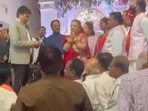 The bride's mother was seen asking the wedding party to return The bride's mother was seen asking the wedding party to return