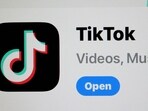 The TikTok app is displayed on an iPhone screen in Miami, Florida. US president Joe Biden signed a foreign aid package that includes a bill that would ban TikTok if China-based parent company ByteDance fails to sell the app to an American company within a year. 