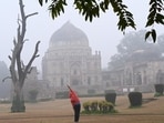 Morning walkers during a cold and foggy morning at Lodhi Garden in New Delhi, India. Morning walkers during a cold and foggy morning at Lodhi Garden in New Delhi, India.