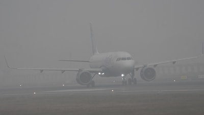 Aircraft operations at Chennai Airport have been disrupted by the Airports Authority of India (AAI) cancelling three flights and rescheduling thirty others due to the high fog and smoke from burning trash during the Bhogi festival. (Hindustan Times/ Santosh Kumar)
