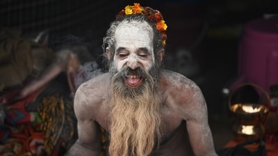 A Naga sadhu, covered in ash, sits in his camp during Mahakumbh 2025 at Mahakumbh Nagar in Prayagraj on Sunday. (Deepak Gupta/HTphoto)