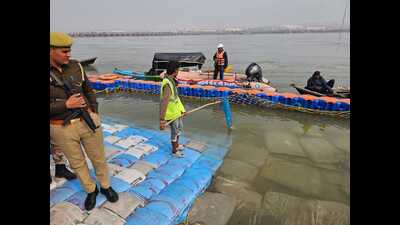 A Ganga sevadoot at a ghat near Sangam on Monday (HT Photo)