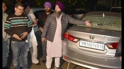Gurpreet Singh Raju Baba, husband of AAP’s Ward 75 councillor Simranpreet Kaur, showing a bullet mark on his car in Kidwai Nagar, Ludhiana, on Monday. (HT Photo) Gurpreet Singh Raju Baba, husband of AAP’s Ward 75 councillor Simranpreet Kaur, showing a bullet mark on his car in Kidwai Nagar, Ludhiana, on Monday. (HT Photo)