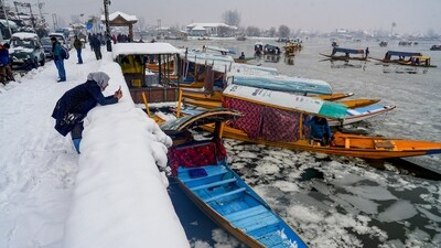Tourists around the Dal lake take in the frozen view of the water body in Srinagar, Kashmir. (PTI) Tourists around the Dal lake take in the frozen view of the water body in Srinagar, Kashmir. (PTI)