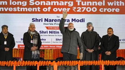 Prime Minister Narendra Modi waving at the gathering after inaugurating the Z-Morh Tunnel at Sonamarg in Ganderbal district on Monday. Union minister for road transport and highways Nitin Gadkari (extreme left) and Union MoS Jitendra Singh (extreme right) were present along with J&K lieutenant governor Manoj Sinha and chief minister Omar Abdullah were present on the occasion. (PTI Photo) Prime Minister Narendra Modi waving at the gathering after inaugurating the Z-Morh Tunnel at Sonamarg in Ganderbal district on Monday. Union minister for road transport and highways Nitin Gadkari (extreme left) and Union MoS Jitendra Singh (extreme right) were present along with J&K lieutenant governor Manoj Sinha and chief minister Omar Abdullah were present on the occasion. (PTI Photo)
