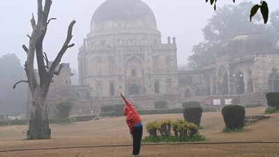 Morning walkers during a cold and foggy morning at Lodhi Garden in New Delhi, India. (Hindustan Times) Morning walkers during a cold and foggy morning at Lodhi Garden in New Delhi, India. (Hindustan Times)
