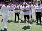 India's Jasprit Bumrah (L) reacts with teammates during the trophy ceremony after the fifth cricket Test match between Australia and India at The SCG in Sydney on January 5 India's Jasprit Bumrah (L) reacts with teammates during the trophy ceremony after the fifth cricket Test match between Australia and India at The SCG in Sydney on January 5