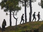 Army personnel patrol near the Line of Control (LOC) in Rajouri district. (PTI FILE PHOTO) Army personnel patrol near the Line of Control (LOC) in Rajouri district. (PTI FILE PHOTO)
