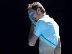Russia's Daniil Medvedev wipes his face between the games against Thailand's Kasidit Samrej during their men's singles match on day three of the Australian Open tennis tournament in Melbourne