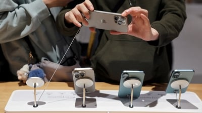 A man checks an iPhone 16 Pro Max as the new iPhone 16 series smartphones go on sale at an Apple store in Beijing, China September 20, 2024. REUTERS//File Photo (Florence Lo/Reuters)