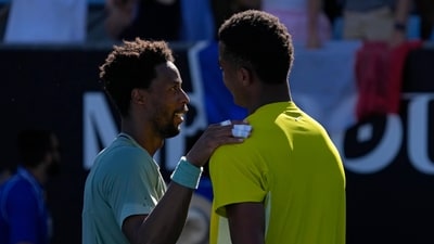 Gael Monfils, left, of France is congratulated by compatriot Giovanni Mpetshi Perricard following their first round match at the Australian Open (AP) Gael Monfils, left, of France is congratulated by compatriot Giovanni Mpetshi Perricard following their first round match at the Australian Open (AP)