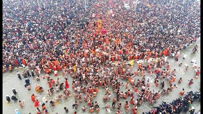 Flower petals being showered on devotees during the first ‘Amrit Snan’ at the Mahakumbh on Makar Sankranti, at Sangam in Prayagraj, Tuesday. (PTI Photo) Flower petals being showered on devotees during the first ‘Amrit Snan’ at the Mahakumbh on Makar Sankranti, at Sangam in Prayagraj, Tuesday. (PTI Photo)