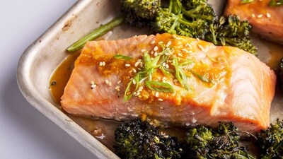 This image released by Milk Street shows a recipe for honey-miso salmon and broccolini traybake. (Milk Street via AP) This image released by Milk Street shows a recipe for honey-miso salmon and broccolini traybake. (Milk Street via AP)