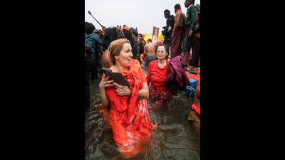 Foreign devotees take a dip at Triveni Sangam on the occasion of 'Makar Sankranti' during the ongoing Maha Kumbh 2025, in Prayagraj on Tuesday. (ANI) Foreign devotees take a dip at Triveni Sangam on the occasion of 'Makar Sankranti' during the ongoing Maha Kumbh 2025, in Prayagraj on Tuesday. (ANI)