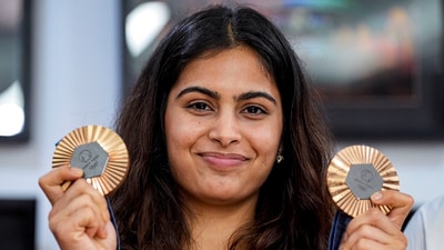 Paris Olympics bronze medallist shooter Manu Bhaker poses with her medals. (PTI) Paris Olympics bronze medallist shooter Manu Bhaker poses with her medals. (PTI)