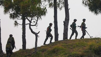 Army personnel patrol near the Line of Control (LOC) in Rajouri district. (PTI FILE PHOTO) Army personnel patrol near the Line of Control (LOC) in Rajouri district. (PTI FILE PHOTO)
