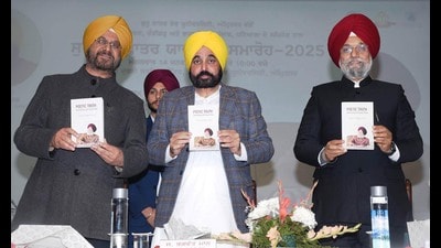Punjab chief minister Bhagwant Mann along with others releasing a book during the Surjit Patar Memorial Ceremony, 2025, at Guru Nanak Dev University, Amritsar, on Tuesday. (HT Photo)