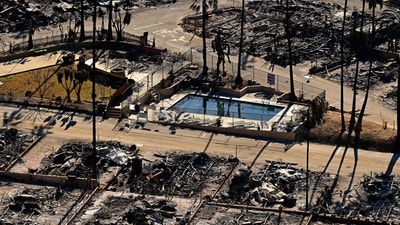 Los Angeles wildfires: A swimming pool sits amid charred homes and burnt cars in the rubble of the fire-ravaged Pacific Palisades Bowl Mobile Estates in Los Angeles, California, on January 13, 2025. (Agustin Paullier/AFP) Los Angeles wildfires: A swimming pool sits amid charred homes and burnt cars in the rubble of the fire-ravaged Pacific Palisades Bowl Mobile Estates in Los Angeles, California, on January 13, 2025. (Agustin Paullier/AFP)