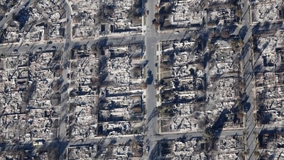 Los Angeles wildfires:: An aerial view of a fire truck near homes destroyed in the Palisades Fire as wildfires cause damage and loss through the LA region on January 13, 2025 in Pacific Palisades, California. (Mario Tama/Getty Images via AFP) Los Angeles wildfires:: An aerial view of a fire truck near homes destroyed in the Palisades Fire as wildfires cause damage and loss through the LA region on January 13, 2025 in Pacific Palisades, California. (Mario Tama/Getty Images via AFP)