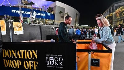 Los Angeles wildfires: People drop off donations for victims of the Los Angeles area fires before the Los Angeles Lakers host the San Antonio Spurs at Crypto Arena in downtown Los Angeles on January 13, 2025. (Kevork Djansezian/AP) Los Angeles wildfires: People drop off donations for victims of the Los Angeles area fires before the Los Angeles Lakers host the San Antonio Spurs at Crypto Arena in downtown Los Angeles on January 13, 2025. (Kevork Djansezian/AP)