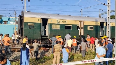 People gather at the site after a passenger train derailed near Tamil Nadu's Villupuram Railway Station. (PTI) People gather at the site after a passenger train derailed near Tamil Nadu's Villupuram Railway Station. (PTI)