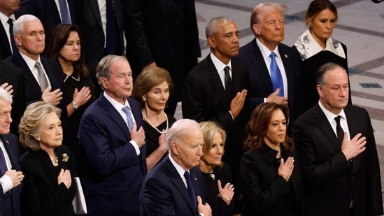 In order to demonstrate to the world the peaceful transition of power, the United States has a long history of having the individuals who defeated presidential candidates on the inaugural stage with them. (Getty Images via AFP)