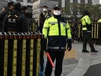 Police officers stand guard in front of the Constitutional Court in Seoul on January 14, 2025 Police officers stand guard in front of the Constitutional Court in Seoul on January 14, 2025