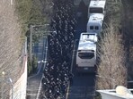 Police officers and investigators of the Corruption Investigation Office for High-ranking Officials leave the official residence of impeached South Korean President Yoon Suk Yeol, following his arrest, in Seoul, on January 15, 2025.