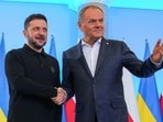 Ukraine's President Volodymyr Zelenskiy and Polish Prime Minister Donald Tusk shake hands as they meet at the Chancellery of the Prime Minister in Warsaw, Poland, January 15, 2025.