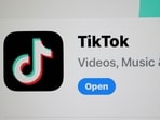The TikTok app is displayed on an iPhone screen in Miami, Florida. US president Joe Biden signed a foreign aid package that includes a bill that would ban TikTok if China-based parent company ByteDance fails to sell the app to an American company within a year. 