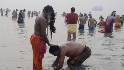 A devotee seeks blessings of a sadhu at the Ganga river on the occasion of the 'Makar Sankranti' festival during the ongoing Gangasagar Mela 2025 in North 24 Parganas. Senior West Bengal minister Aroop Biswas said a total of 85 lakh pilgrims have taken the holy dip since January 1. (ANI) A devotee seeks blessings of a sadhu at the Ganga river on the occasion of the 'Makar Sankranti' festival during the ongoing Gangasagar Mela 2025 in North 24 Parganas. Senior West Bengal minister Aroop Biswas said a total of 85 lakh pilgrims have taken the holy dip since January 1. (ANI)