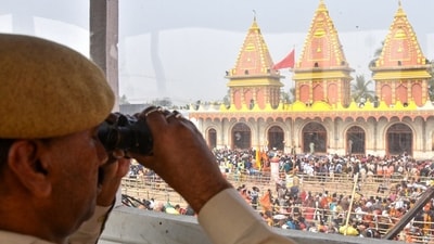 Security personnel keep a strict vigil as devotees arrive to take a dip on the occasion of ‘Makar Sankranti’. Around 13,000 policemen and 2,500 civil defence personnel, apart from disaster management teams and the Indian Coast Guard, are monitoring the activities. (ANI) Security personnel keep a strict vigil as devotees arrive to take a dip on the occasion of ‘Makar Sankranti’. Around 13,000 policemen and 2,500 civil defence personnel, apart from disaster management teams and the Indian Coast Guard, are monitoring the activities. (ANI)