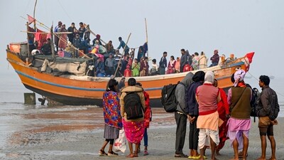 Devotees return to their hometowns after attending the Gangasagar Mela 2025 at Sagar Island, in South 24 Parganas district. (PTI) Devotees return to their hometowns after attending the Gangasagar Mela 2025 at Sagar Island, in South 24 Parganas district. (PTI)