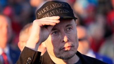 Tesla and SpaceX CEO Elon Musk listens as Republican presidential nominee former President Donald Trump speaks at a campaign event at the Butler Farm Show, on Oct. 5, 2024, in Butler, Pa. (Alex Brandon/AP) Tesla and SpaceX CEO Elon Musk listens as Republican presidential nominee former President Donald Trump speaks at a campaign event at the Butler Farm Show, on Oct. 5, 2024, in Butler, Pa. (Alex Brandon/AP)