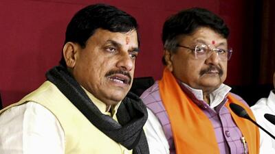 Madhya Pradesh chief minister Mohan Yadav (left) addresses a press conference in Bhopal on Dec 26 (PTI File Photo)