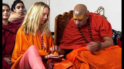 Philanthropist Laurene Powell Jobs, wife of Apple co-founder Steve Jobs, receives spiritual initiation from her guru Niranjani Peethadheeshwar Swami Kailashanand Giri, amid the Mahakumbh, in Prayagraj. (PTI Photo) Philanthropist Laurene Powell Jobs, wife of Apple co-founder Steve Jobs, receives spiritual initiation from her guru Niranjani Peethadheeshwar Swami Kailashanand Giri, amid the Mahakumbh, in Prayagraj. (PTI Photo)