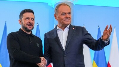 Ukraine's President Volodymyr Zelenskiy and Polish Prime Minister Donald Tusk shake hands as they meet at the Chancellery of the Prime Minister in Warsaw, Poland, January 15, 2025. (REUTERS)