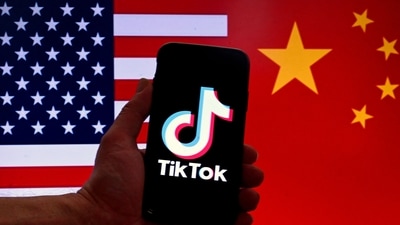 TikTok logo is displayed on the screen of an iPhone in front of a US flag and Chinese flag background in Washington, DC. (AFP) TikTok logo is displayed on the screen of an iPhone in front of a US flag and Chinese flag background in Washington, DC. (AFP)