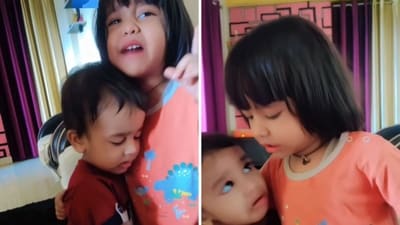 A sister shielding her brother from their mom’s scolding. (Screengrab) A sister shielding her brother from their mom’s scolding. (Screengrab)