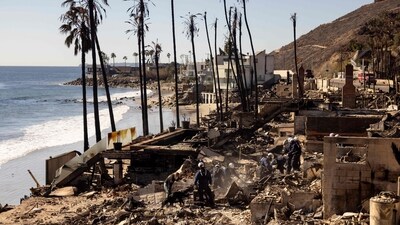 Firefighters with the California Task Force 3 Urban Search and Rescue comb through the ruins of a beachfront house where victims of the Los Angeles fires are reportedly buried, in Malibu, California. (ETIENNE LAURENT / AFP) Firefighters with the California Task Force 3 Urban Search and Rescue comb through the ruins of a beachfront house where victims of the Los Angeles fires are reportedly buried, in Malibu, California. (ETIENNE LAURENT / AFP)