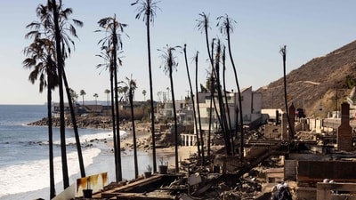Firefighters with the California Task Force 3 Urban Search and Rescue comb through the ruins of a beachfront house where victims of the Los Angeles fires are reportedly buried, in Malibu, California. (ETIENNE LAURENT / AFP) Firefighters with the California Task Force 3 Urban Search and Rescue comb through the ruins of a beachfront house where victims of the Los Angeles fires are reportedly buried, in Malibu, California. (ETIENNE LAURENT / AFP)