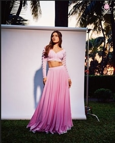 Raashii Khanna cuts an elegant figure in a pink lehenga and pearl embellished full-sleeved blouse by Shivani Macharla. Raashii Khanna cuts an elegant figure in a pink lehenga and pearl embellished full-sleeved blouse by Shivani Macharla.