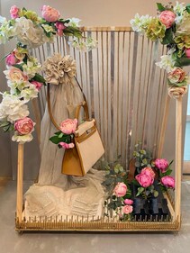 Bag in a minimalistic floral wooden display. (PC: Ferns N Petals) Bag in a minimalistic floral wooden display. (PC: Ferns N Petals)