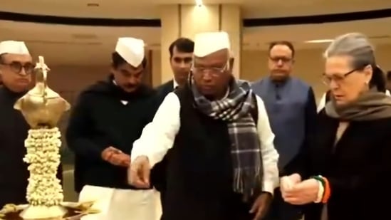 Congress president Mallikarjun Kharge and former president Sonia Gandhi light a lamp during the innauguration of new party headquarters in New Delhi on Tuesday. (ANI)