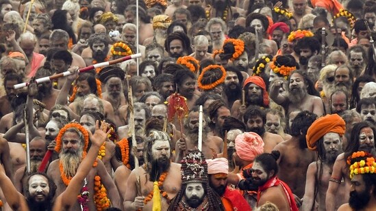 Juna Akhara's Naga Sadhus throng at Triveni Sangam to take 'Amrit Snan' on the occasion of 'Makar Sankranti' during the ongoing Mahakumbh 2025 in Prayagraj on Tuesday. (ANI)