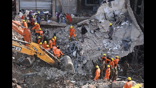 The collapse had claimed the lives of a 20-year-old woman, who lived as a paying guest in the four-storey building, and a 30-year-old man who was working out in a gym housed in the structure. (Sanjeev Sharma/HT)