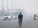 Commuters step out on a cold foggy morning in New Delhi. Commuters step out on a cold foggy morning in New Delhi.