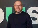 Comedian Bill Burr mocked misguided suggestions and conspiracy theories about the fires, emphasizing the real dangers faced by those battling the blazes and the investigation into their cause. (Photo by Andy Kropa/Invision/AP)(Andy Kropa/Invision/AP)