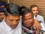 Congress MLA and former state excise minister Kawasi Lakhma, right, being taken to court by the Enforcement Directorate (ED) officials in an alleged liquor scam, in Raipur, Chhattisgarh. Congress MLA and former state excise minister Kawasi Lakhma, right, being taken to court by the Enforcement Directorate (ED) officials in an alleged liquor scam, in Raipur, Chhattisgarh.
